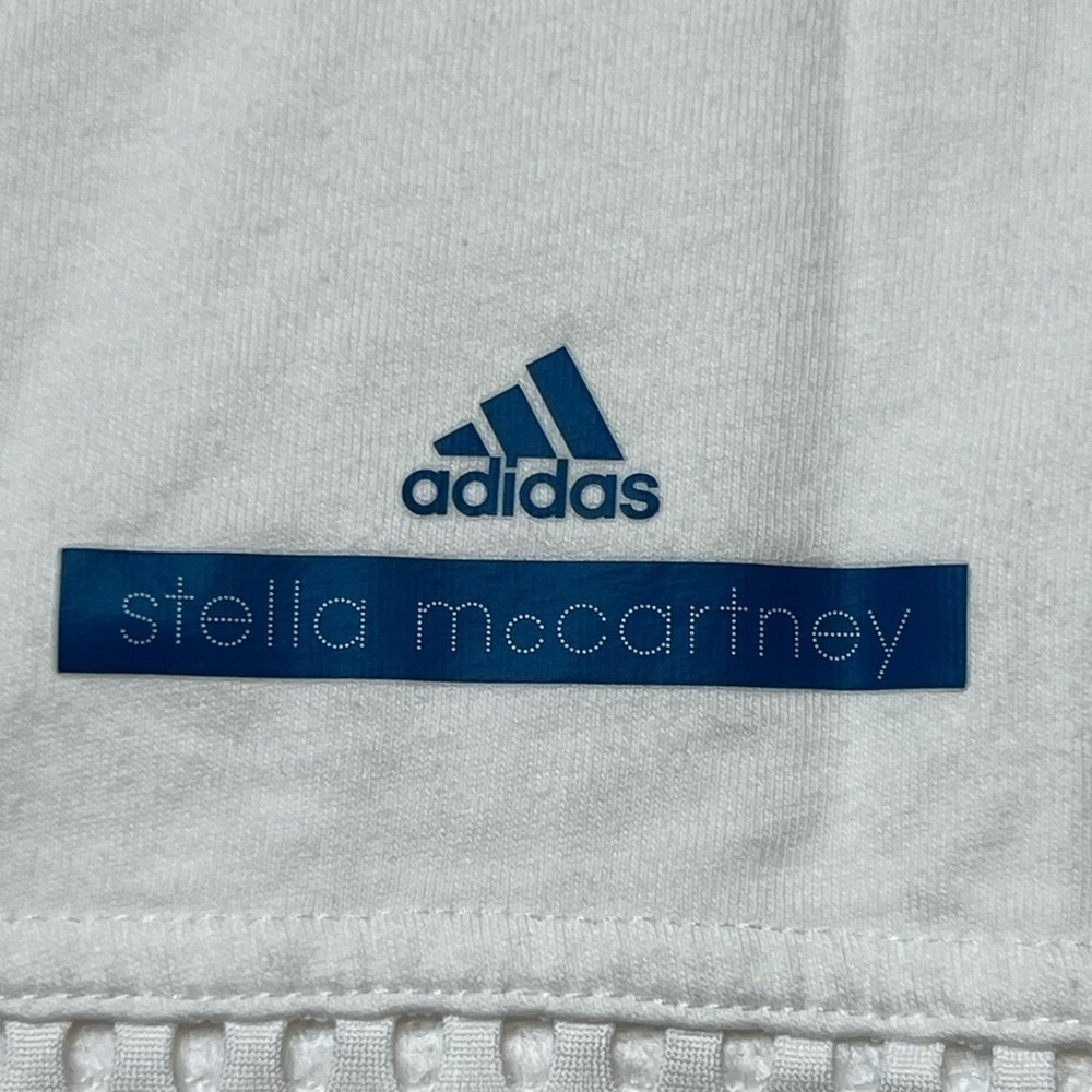 White adidas work out active shirt with mesh on the top and bottom. - Picture 6 of 8
